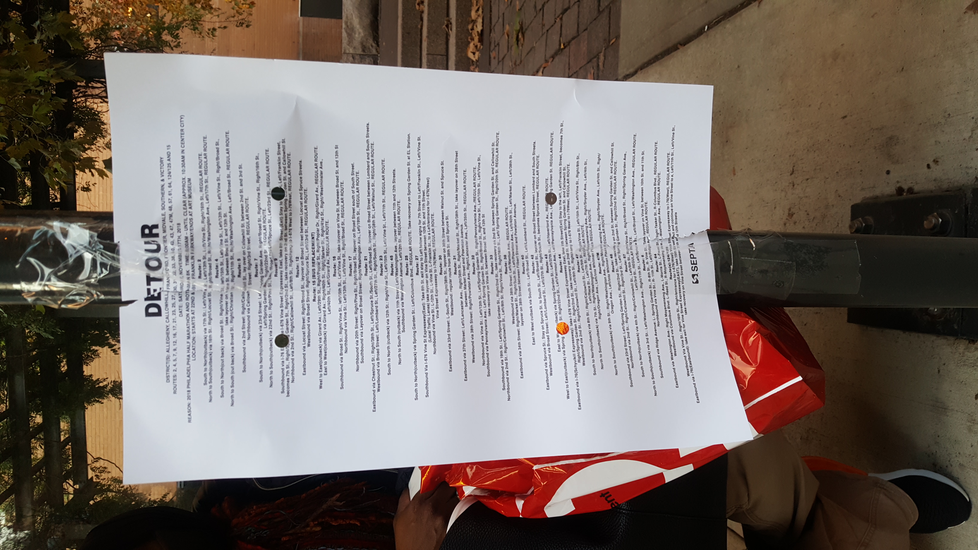 barely legible SEPTA detour sign on bus stop pole