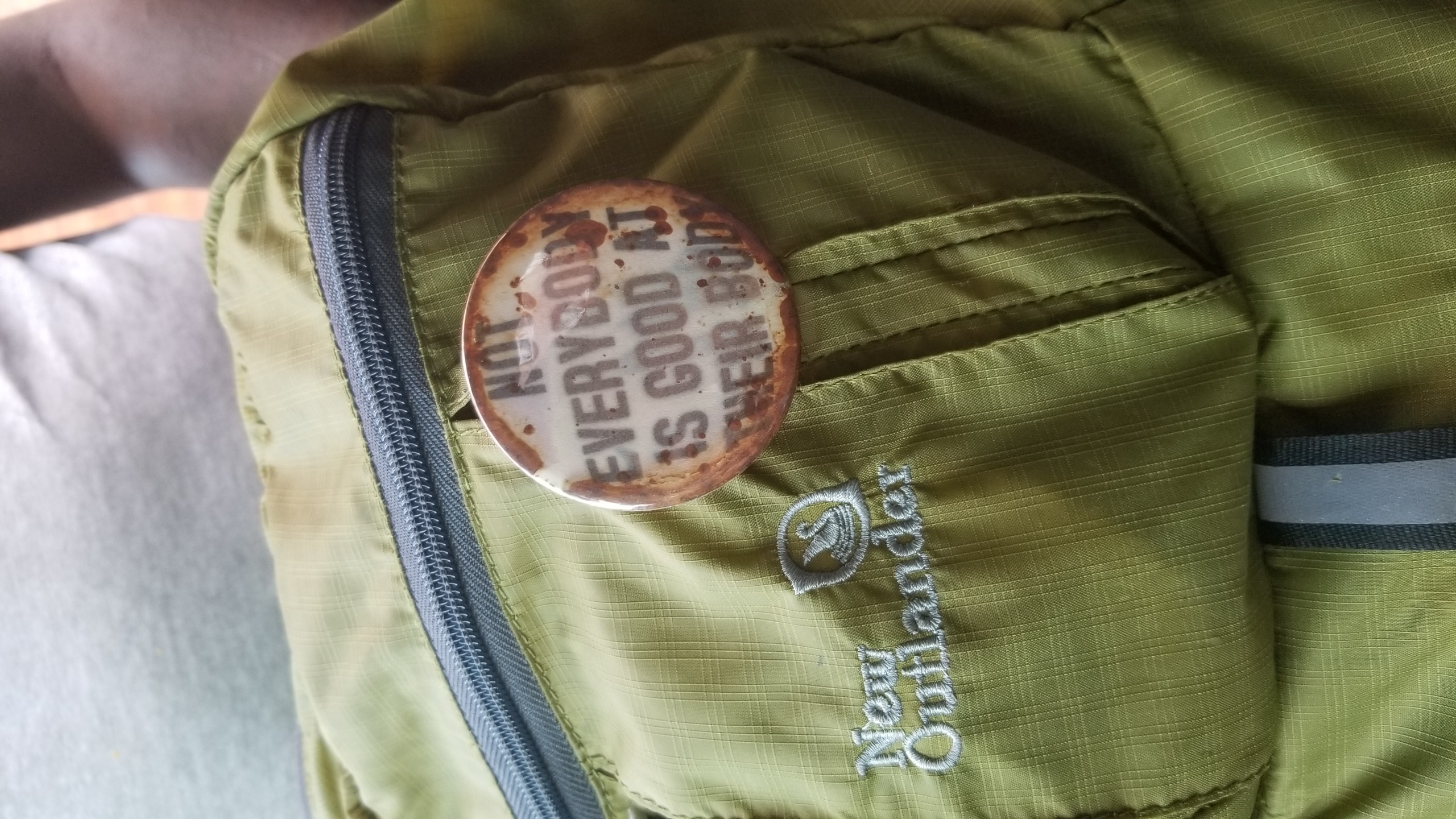 rusty pin with slogan