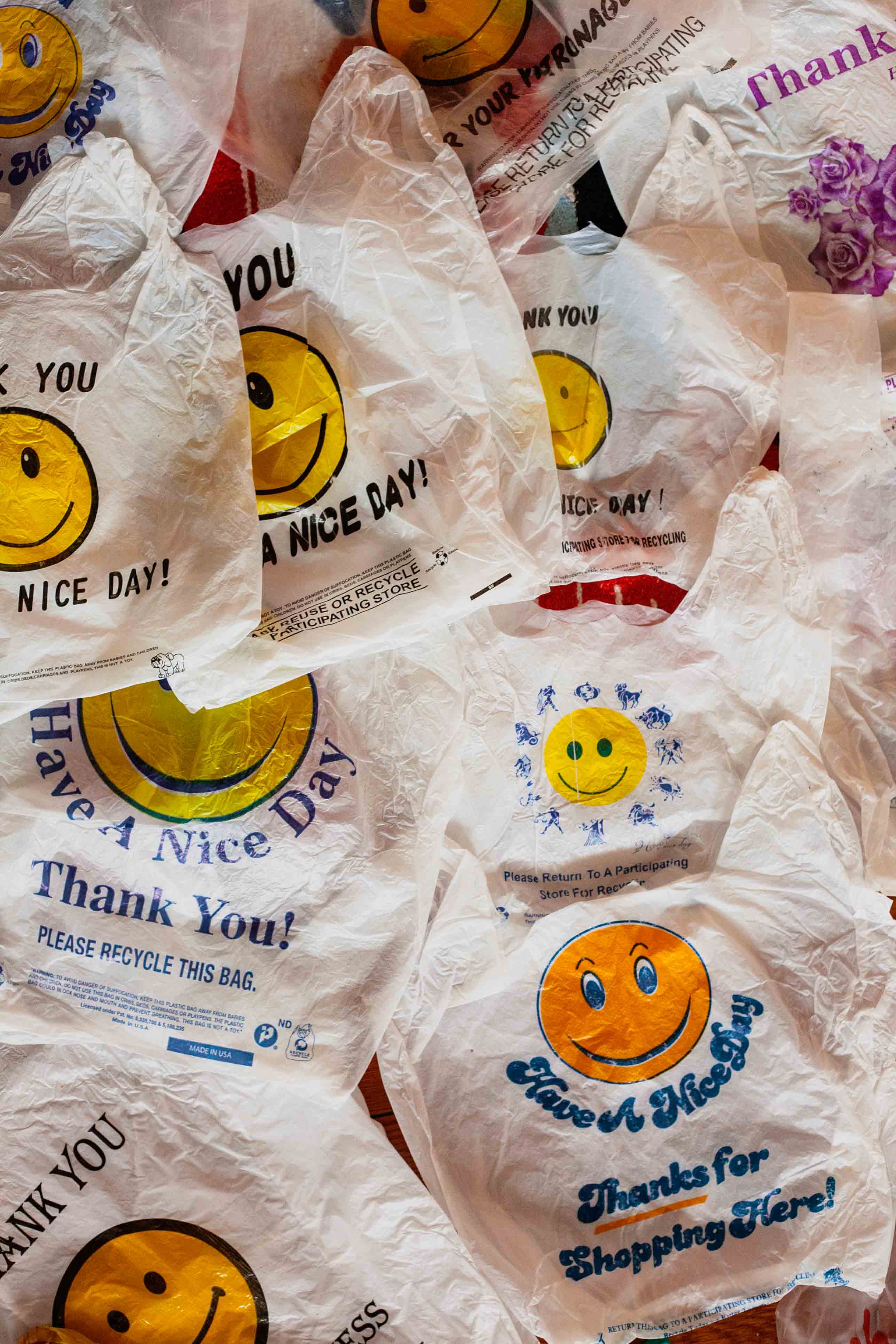 flattened plastic 'thank you' takeout bags layered on each other