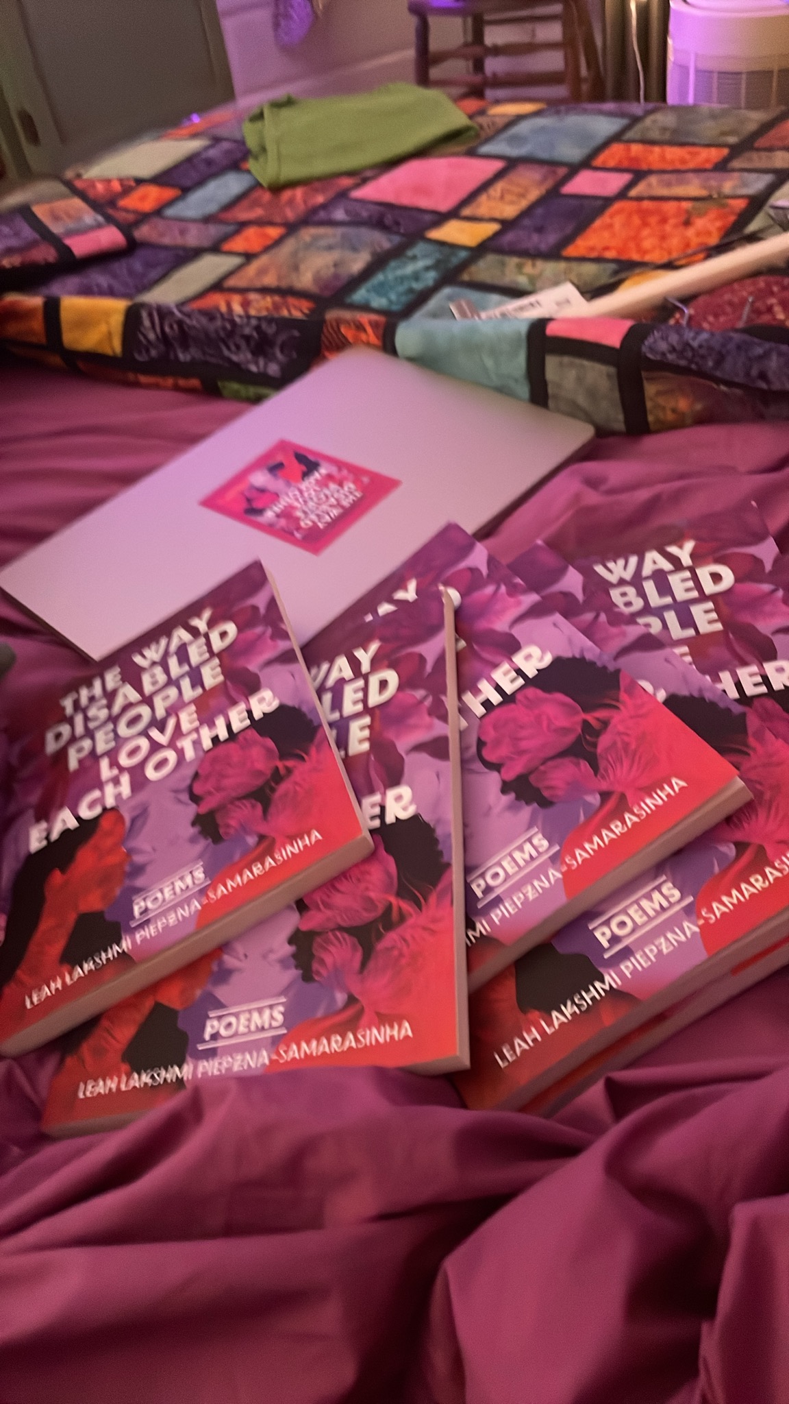 several of same book on a bed